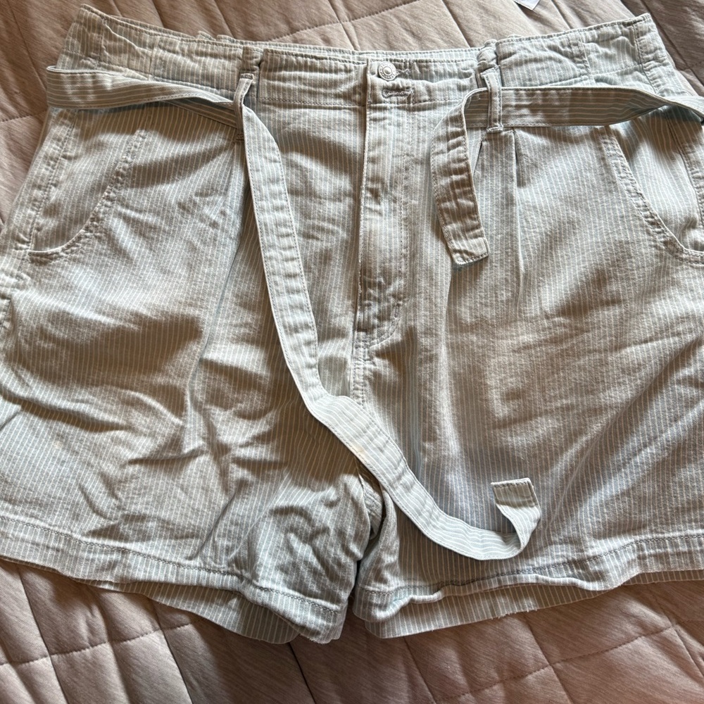AE “paper bag” shorts size 22. Faded blue and white stripes. Pockets and belt.